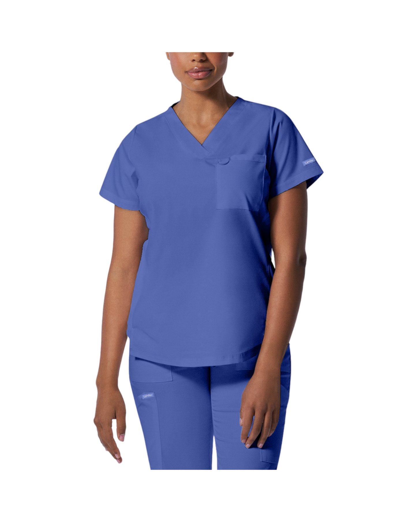 Haut d'uniformes à col en V coupe moderne pour femme avec des coutures princesses. Landau Proflex #LT107 couleur bleu ciel.