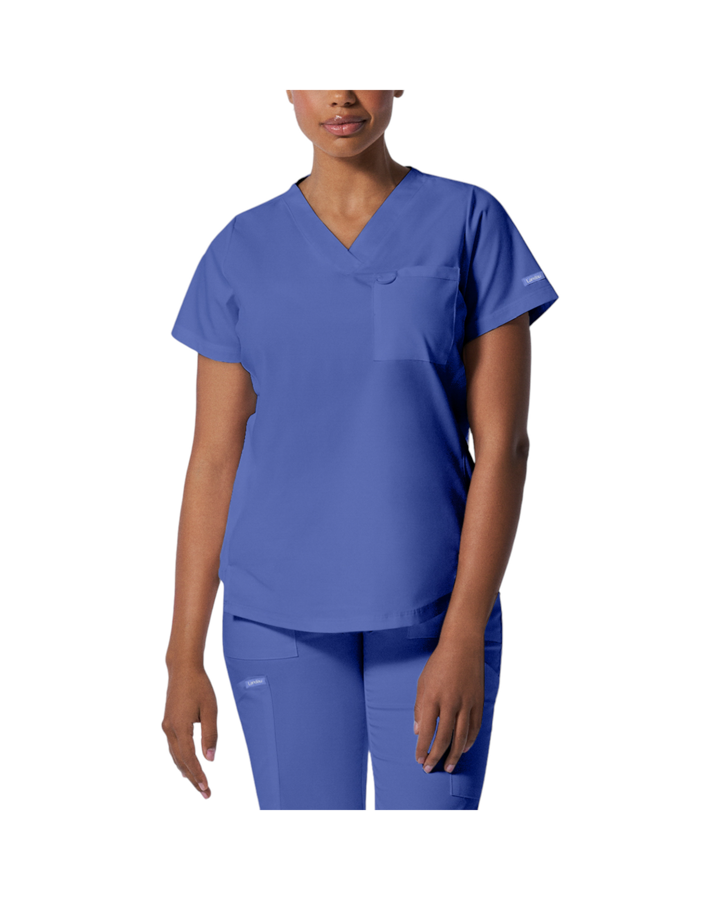 Haut d'uniformes à col en V coupe moderne pour femme avec des coutures princesses.  Landau Proflex #LT107 couleur bleu ciel.