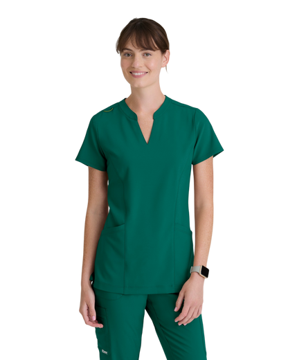 Grey's Anatomy Evolve women's 2 -pocket banded notched neck top #GSST298
